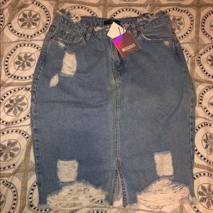 Distressed light wash denim skirt